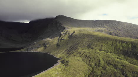 Beautiful-aerial-of-irish-highlandwith-grass-covered-mountains