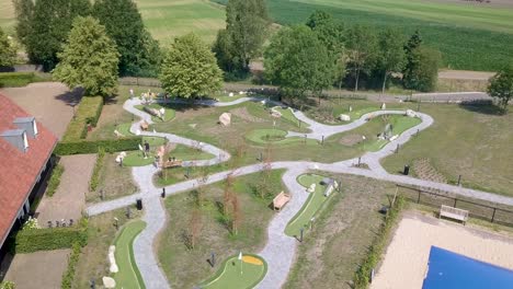 Close-up-aerial-view-of-people-playing-miniature-golf