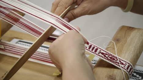 Red-and-white-yarn-weaved-into-unique-patterns