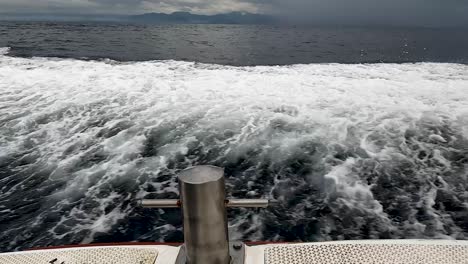 Boat-speeding-through-deep-ocean-to-avoid-massive