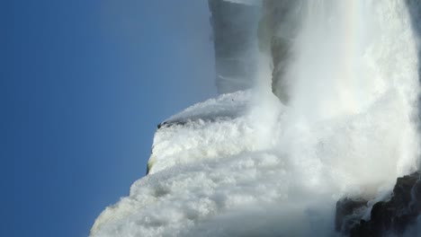 Vertical-Shot-Of-Powerful-Water-Cascade-On-Enormous
