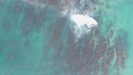 Chasing-crashing-waves-on-Bali-island-coastline-aerial