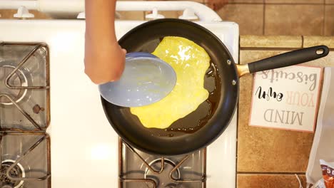 Scrambling-eggs-to-later-add-to-a-fried