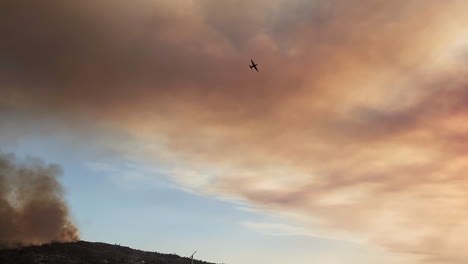 Small-plane-flying-over-forest-fire-Aerial-firefighting