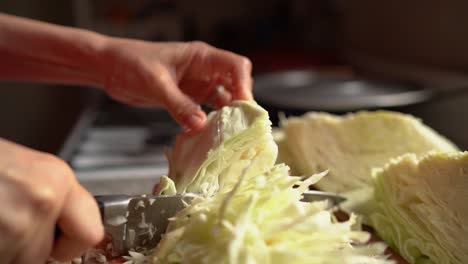 Female-Hands-Finely-Chopping-Fresh-Cabbage-For-Sauerkraut