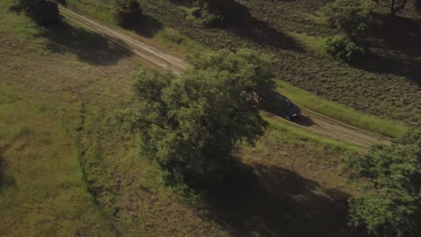 Aerial-drone-shot-following-an-all-terrain-vehicle