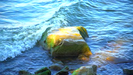Ocean-waves-hit-a-small-rock-or-boulder
