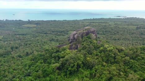 aerial-of-Batu-Baginda-boulder-on-a-cloudy