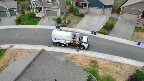 Drone-view-of-a-garbage-truck-loading-a