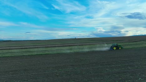 Cinematic-tracking-shot-of-tractor-machinery-Plowing-countryside