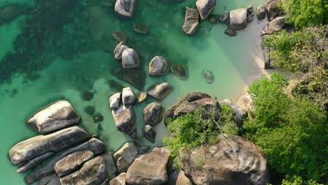 aerial-top-down-of-rocky-island-coastline-with