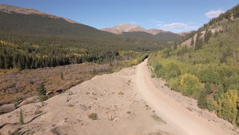 Flying-over-gravel-tailings-and-a-dirt-road