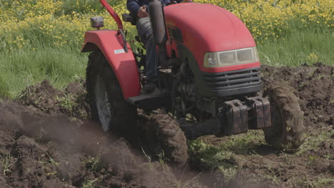A-Farmer-In-Tractor-Plowing-Agricultural-Land-In