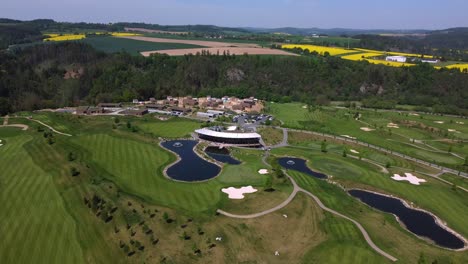 Aerial-drone-view-of-golf-course-and-ponds