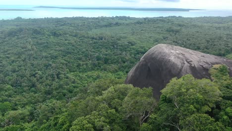 giant-boulder-Batu-Baginda-surrounded-by-dense-forest