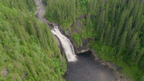 Aerial-View-Of-Storfossen-Waterfall-In-Coniferous-Forest