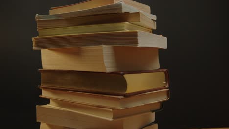 Spinning-pile-of-books-with-black-background