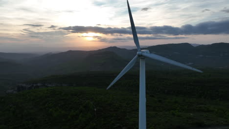 Drone-view-of-wind-turbines-spinning-at-twilight