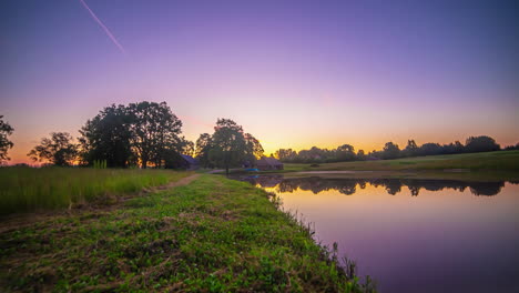 Dusk-To-Dawn-Timelapse-Over-Pond-Water-Surrounded