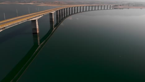 Aerial-Reveal-Shot-of-Long-Lake-bridge-With