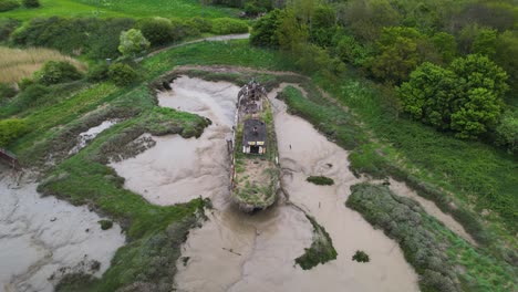 Drone-Aerial-View-of-Abandoned-Wooden-Boat-in