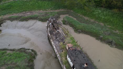 Aerial-View-of-Sunken-Wooden-Boat-in-Decay