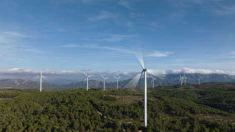Amazing-wind-farm-scene-amongst-forest-and-mountainous