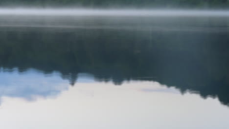 Lake-reflections-with-morning-fog-on-the-water