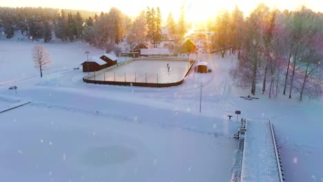 Locals-playing-ice-hockey-during-snowfall-and-golden