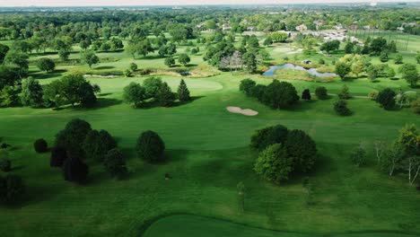 Aerial-drone-rotating-shot-over-golf-club-covered