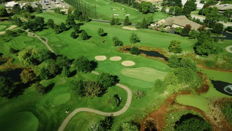 Orbit-Shot-Of-Golf-Course-With-Green-Grass