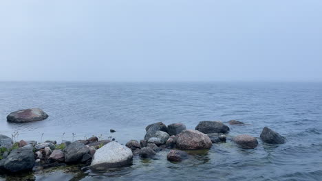 Thick-fog-over-water-creating-a-dramatic-and