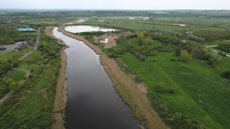 Aerial-View-of-Creek-and-Grassland-in-Wat