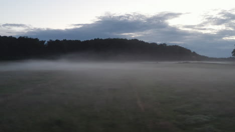 k-Drone-shot-of-morning-fog-over-a