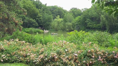 Boaters-on-lake-in-Central-Park-with-flowers