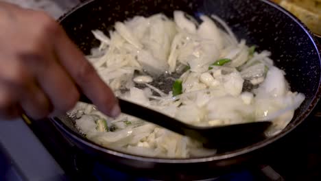 Fresh-Cut-White-Onions-Being-Stirred-In-Simmering