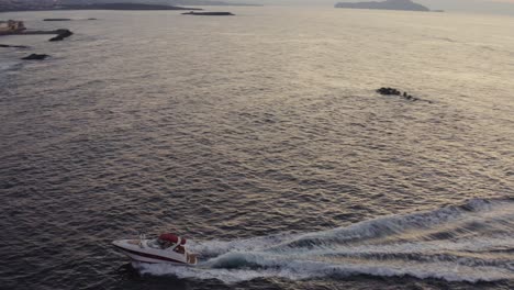 Aerial---Speedboat-entering-the-old-port-of-Chania