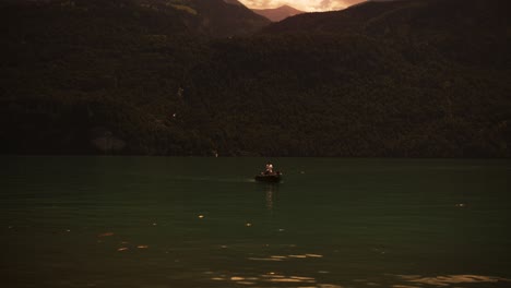 Boat-Lake-Red-Sky-Switzerland-Mountains-Surreal