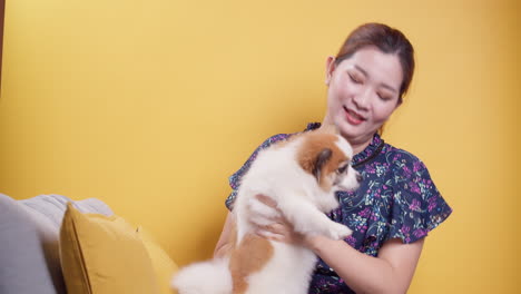 Asian-women-play-with-puppy-pets-hold-a