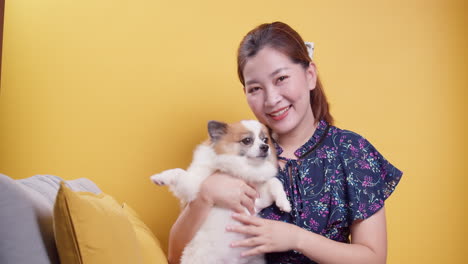 Asian-women-play-with-puppy-pets-hold-a