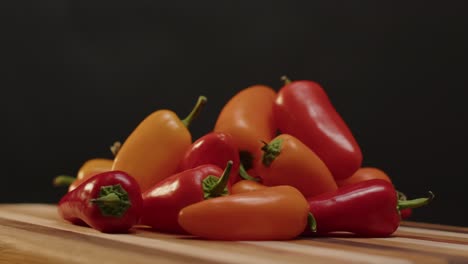Peppers-piled-up-spinning-on-a-cutting-board