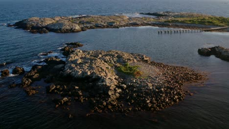 Distant-drone-view-open-ocean-isolated-rocky-islands