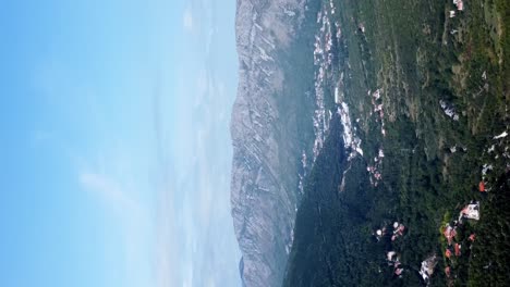 Vertical-Shot-Of-Rocky-Mountains-From-City-Of