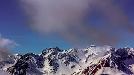 Cloud-movement-over-snowy-mountain-range-timelapse