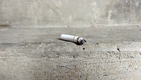 Close-up-of-a-cigarette-with-a-beautiful-puff