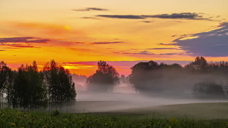 Beautiful-vibrant-sunrise-sky-Timelapse-of-mist-moving