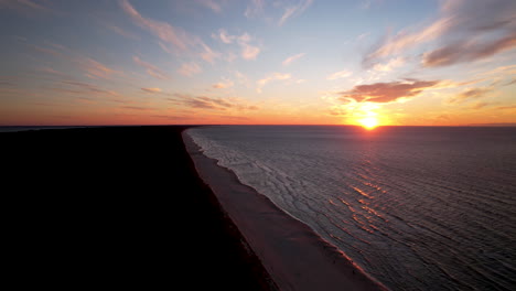 Aerial-Dramatic-Colorful-Sunset-over-Baltic-Sea-Horizon