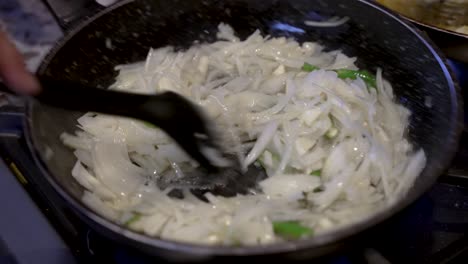 Fresh-Cut-White-Onions-Being-Stirred-In-Simmering