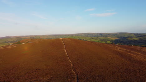 Sunset-Descending-Aerial-Drone-Footage-Over-Moorland-with