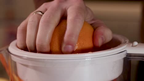 Squeezing-an-orange-with-a-very-poor-squeezer